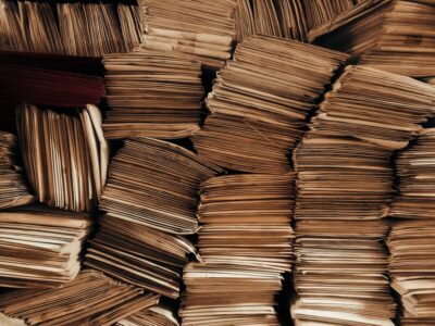 Piles of hundreds of letters, sorted into bundles.