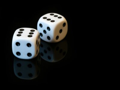 Two dice on a black background.