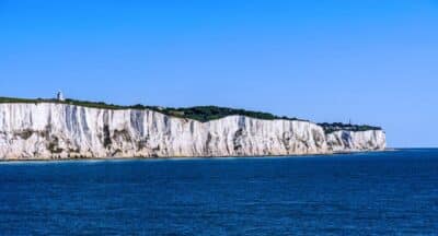White cliffs of Dover against a clear blue sky.