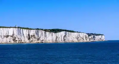 White cliffs of Dover against a clear blue sky.