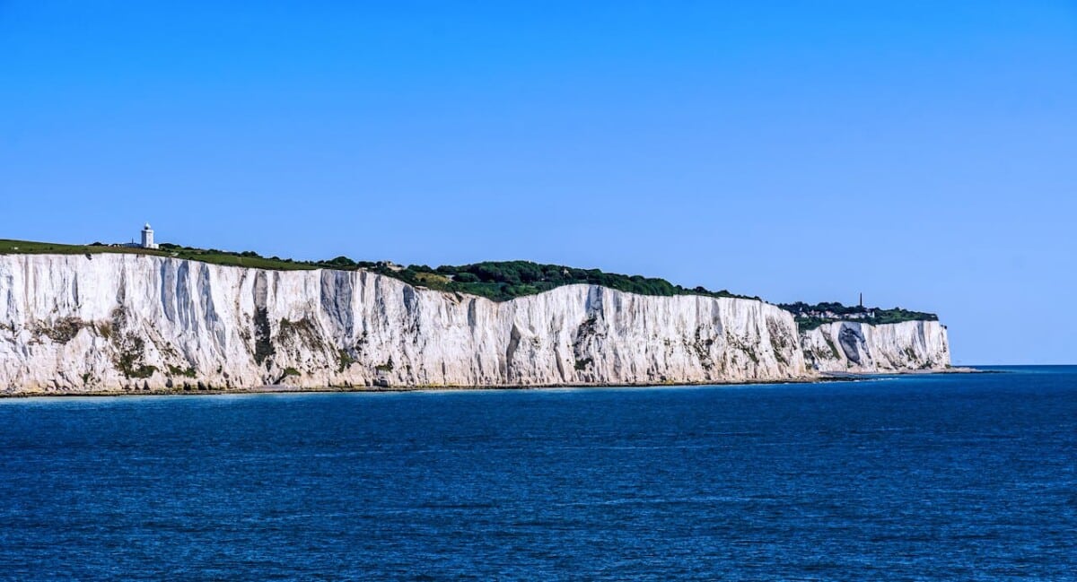 White cliffs of Dover against a clear blue sky.