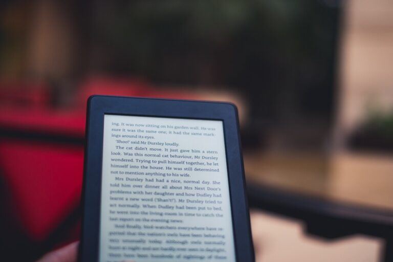 Amazon Kindle being held, with text from Harry Potter legible. Image: Unsplash.com