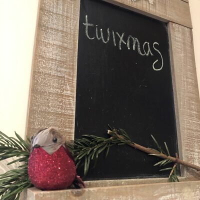 Twixmas - word chalked on a blackboard with a Christmas robin and fir twig beneath it. Photo: Howard Lake