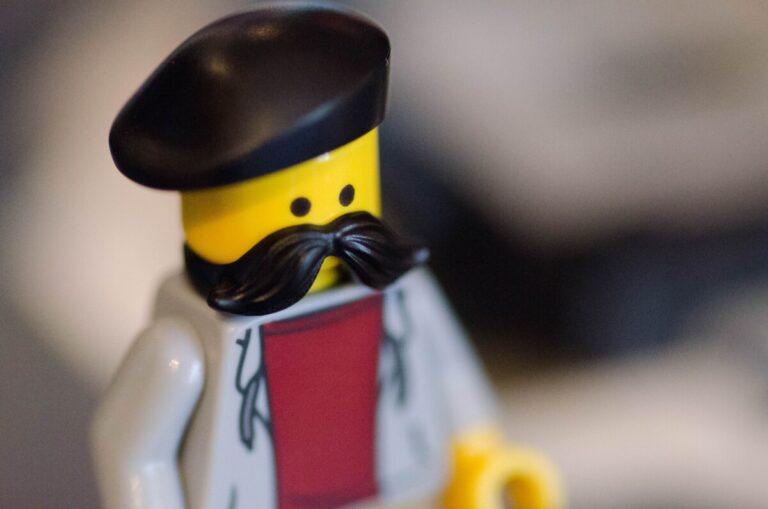 LEGO minifig with a beret and thick black moustache.