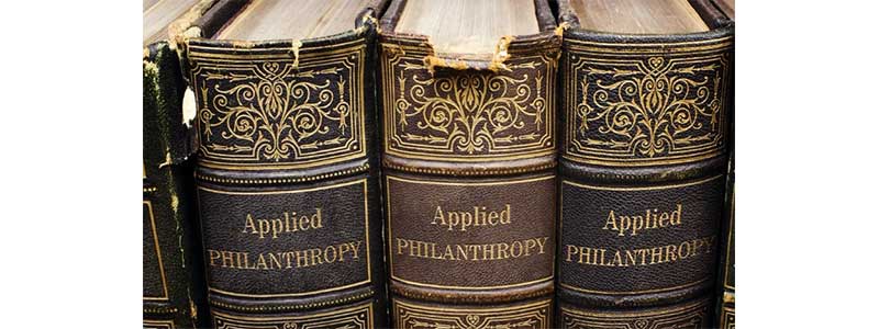 Three books entitled 'Applied philanthropy'. Created with Photofunia.com.