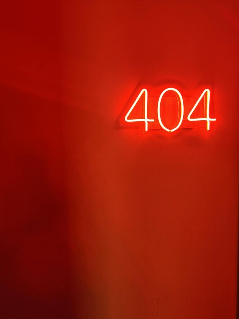 404 - neon sign on a erd background.