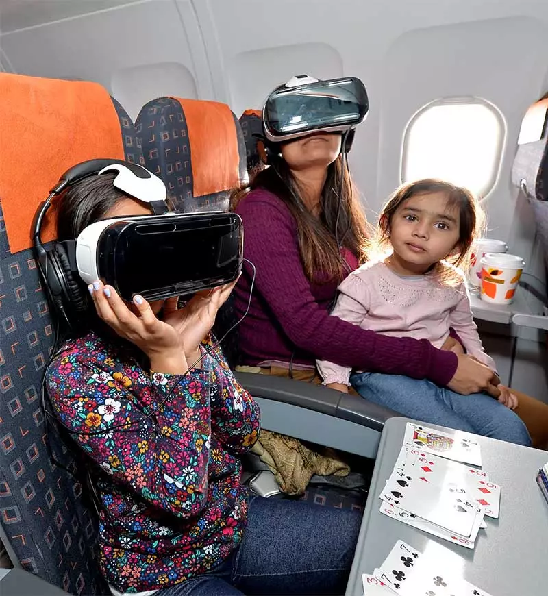 Passengers watch Unicef's virtual reality video about polio as they fly to Portugal