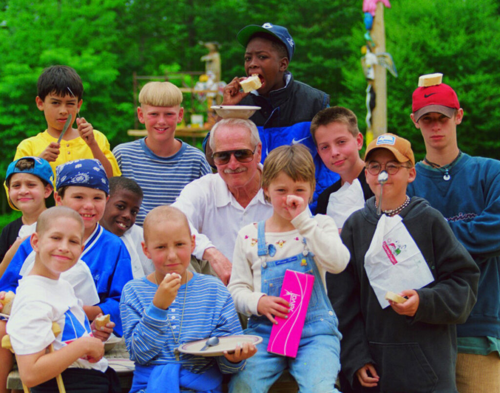 Paul Newman with children at the Over the Wall camp. Photo: Newman's Own Foundation