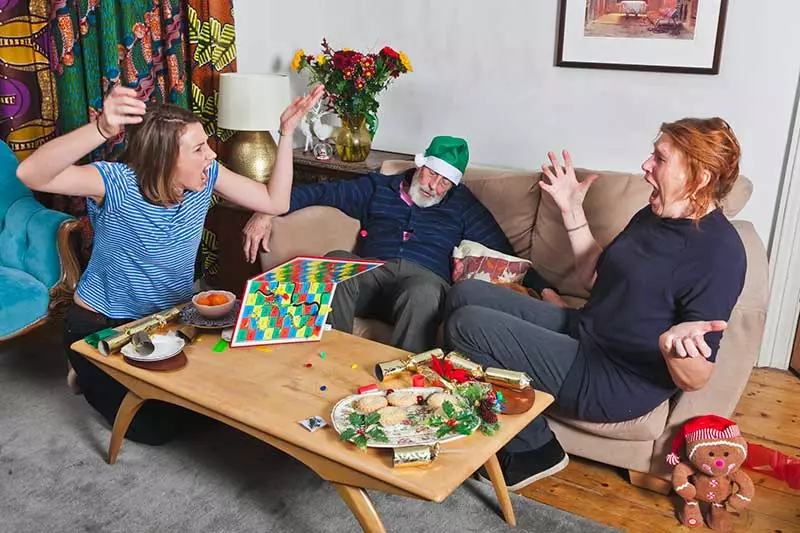 A family argues over a board game at Christmas.