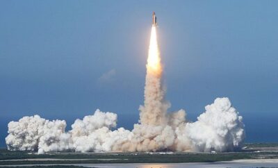 Space shuttle Discovery lifts off.