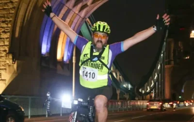 Nightrider London passing under Tower Bridge