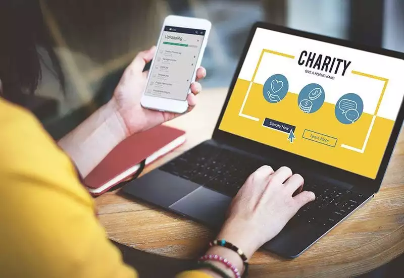 Donating to charity via laptop or mobile