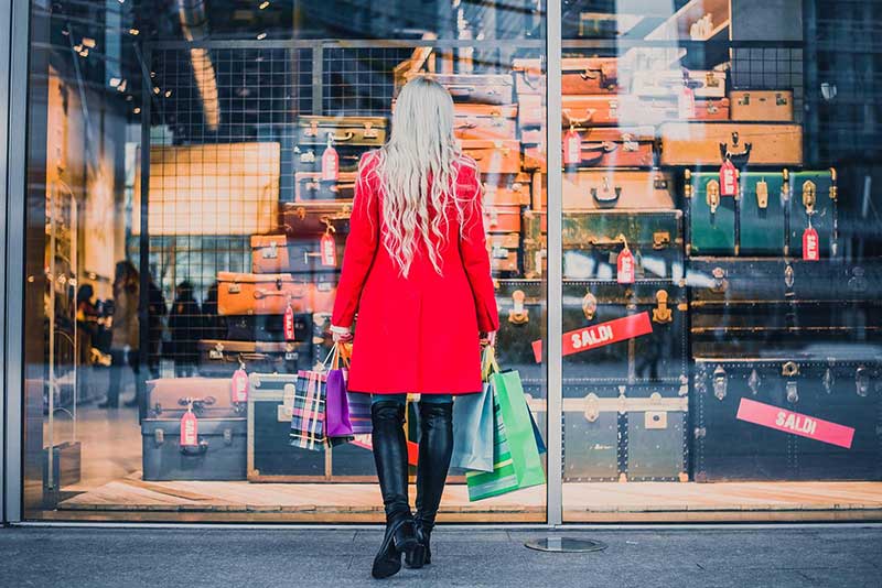 Woman looking into a shop window