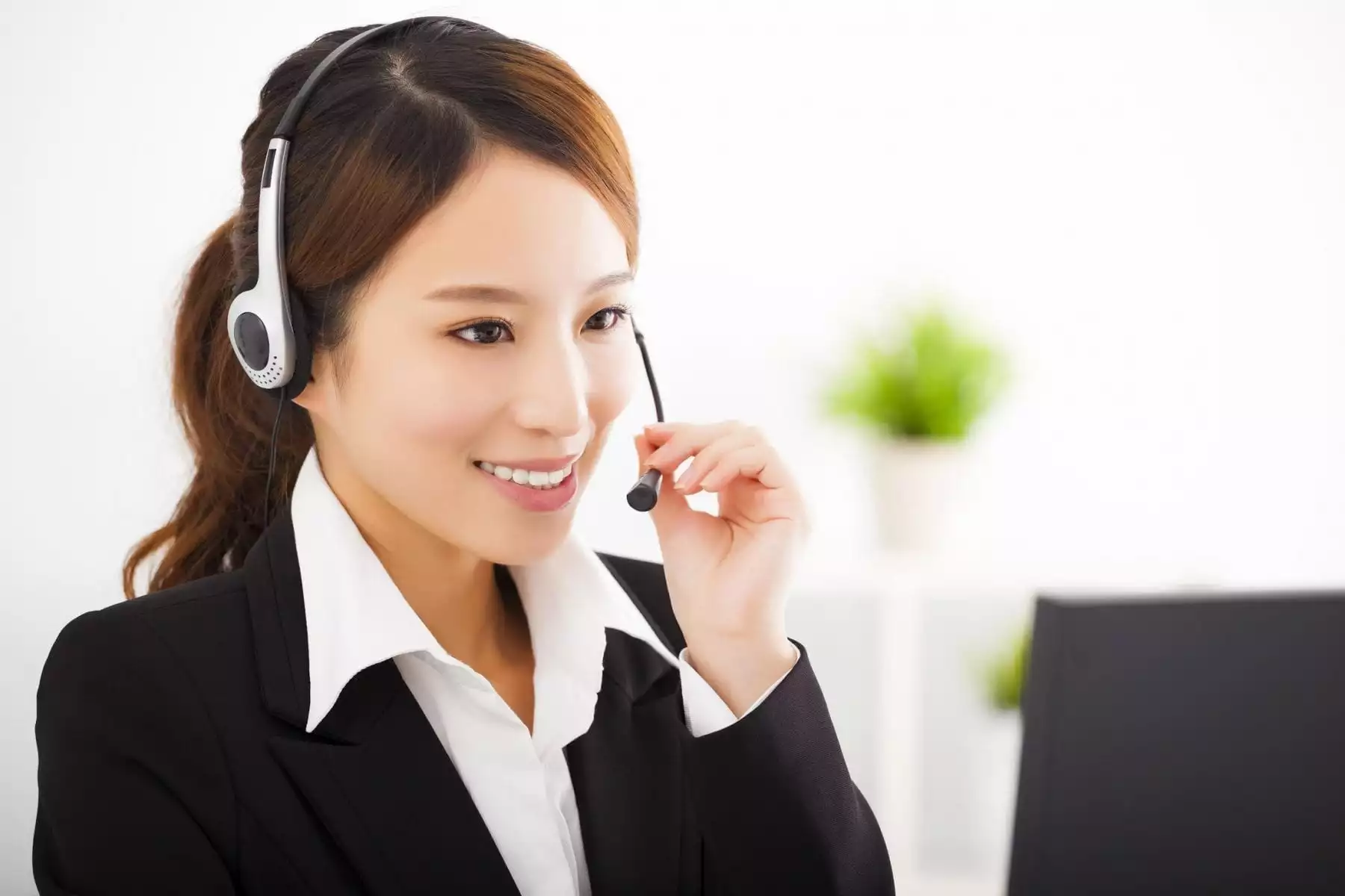 Customer service - woman with headphone and mic