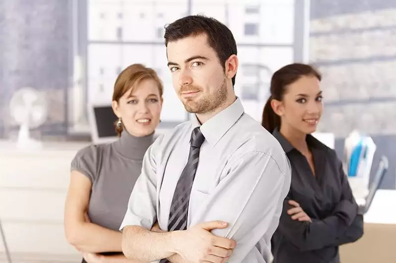 Man and two women in an office