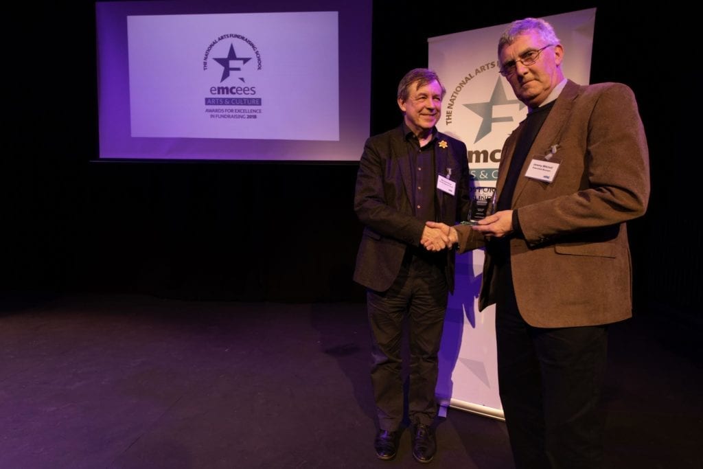 Bernard Ross presents best volunteer award to Jeremy Mitchell
