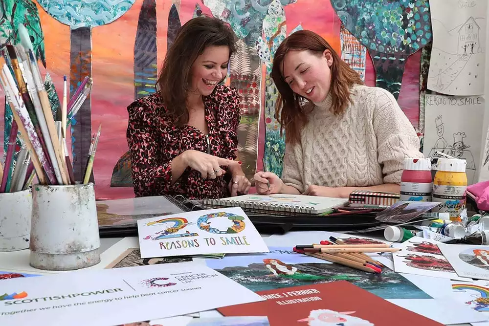 Deborah James and Aimee Ferrier amid designs