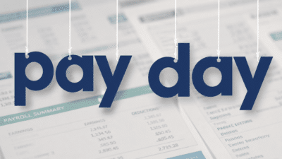 Pay day illustrated with pendant letters against a background of salary reports. Made by Howard Lake with ChatGPT AI.