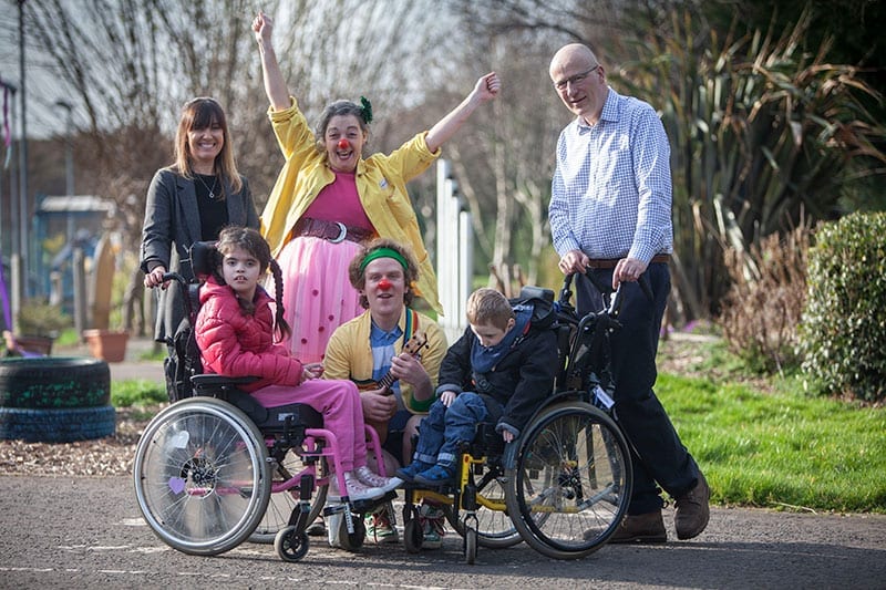 Phillipa Quinn and Mike Thornton (Chairman of the ScottishPower Foundation) with Hearts & Minds Clowndoctors and pupils from Oakland School