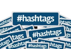 Instagram Hashtags written on multiple blue road sign