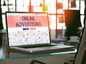 Instagram Online Advertising Concept. Closeup Landing Page on Laptop Screen in Doodle Design Style. On Background of Comfortable Working Place in Modern Office. Blurred, Toned Image. 3D Render.