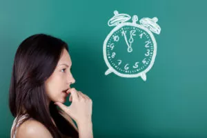 female student trying to decide best time to post on Instagram
