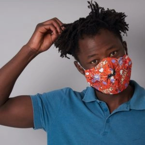 Comic design orange face mask worn by a man