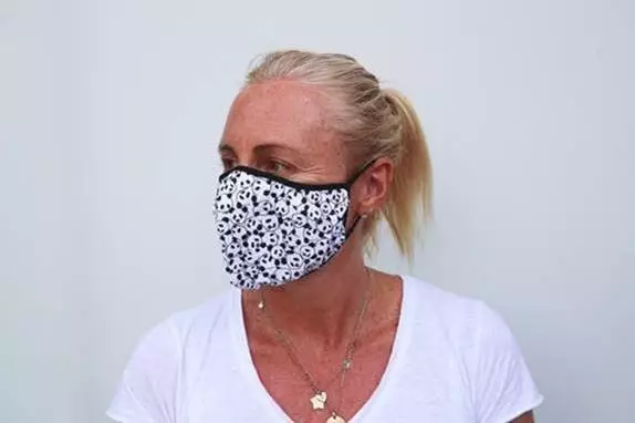 Woman wearing a WWF panda face mask