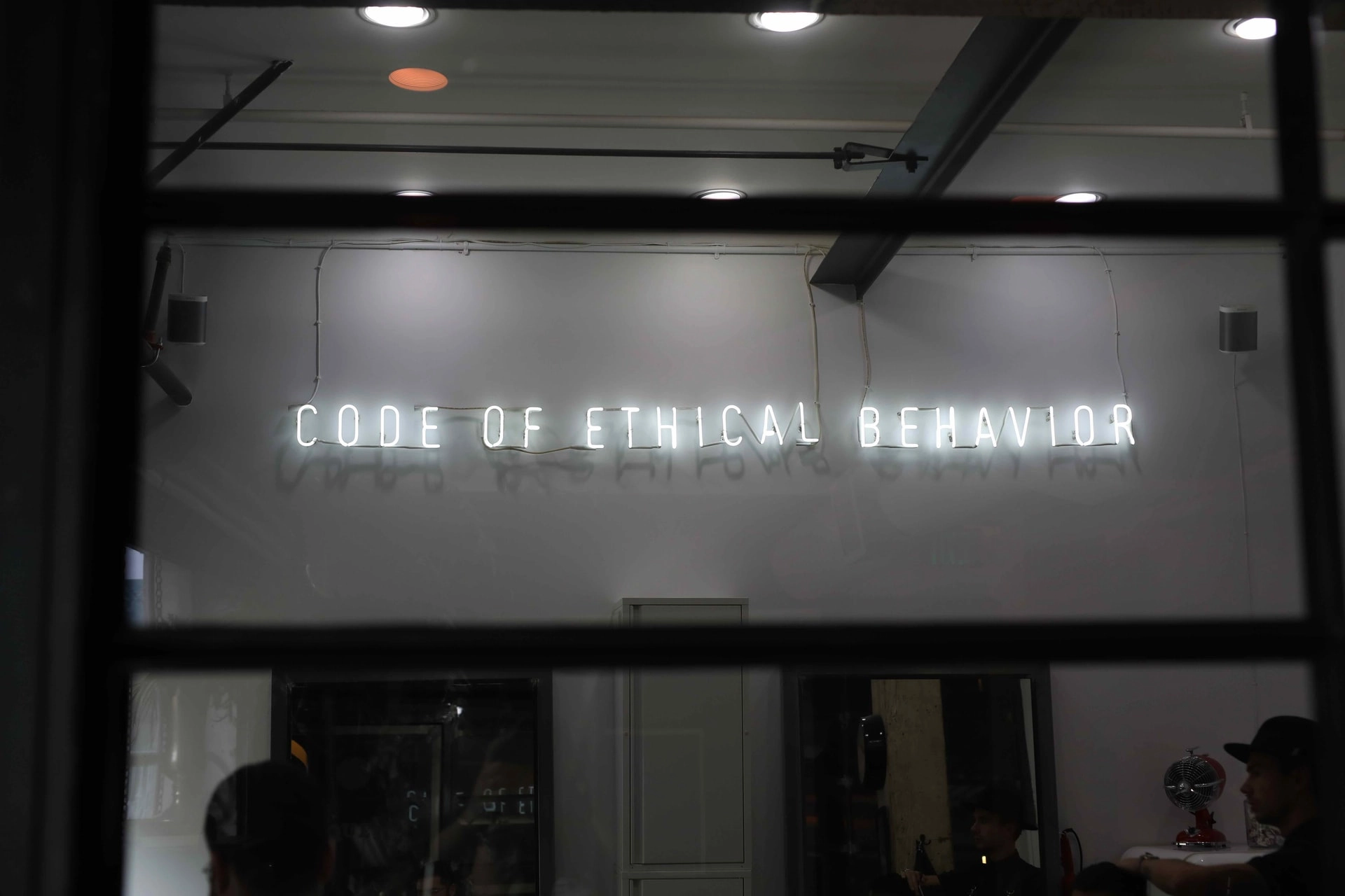 'Code of ethical behavior' neon sign - photo: Unsplash