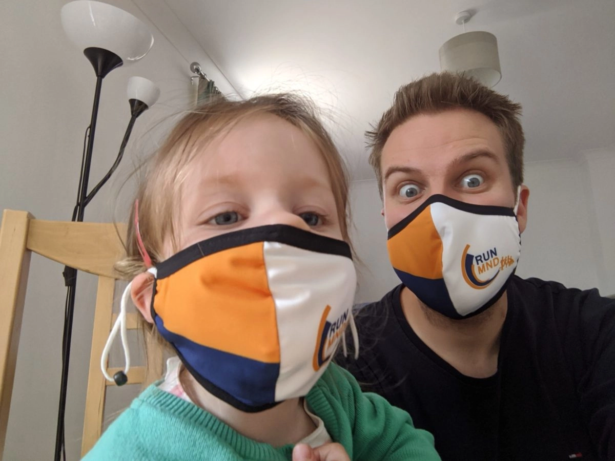 Oli Hiscoe and daughter wearing face masks