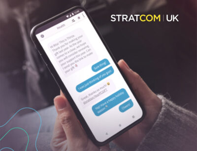 Messaging on a mobile phone, with Stratcom UK logo