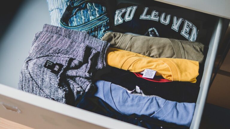 an open drawer of clothes Photo by Francesco Paggiaro from Pexels