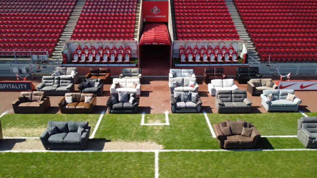 Sofa from ScS in a stadium, representing the number of people diagnosed with bowel cancer each day