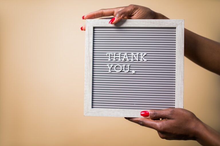 A woman's hands holding a thank you sign by pexels rodnae productions