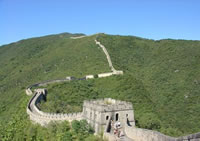 Great Wall of China on wooded hills. Photo: Classictours