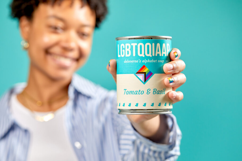 A can of Deliveroo soup being held up