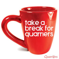Red mug with 'Take a Break for Quarriers' lettering superimposed