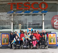 Muscular Dystrophy Campaign supporters outside a Tesco store