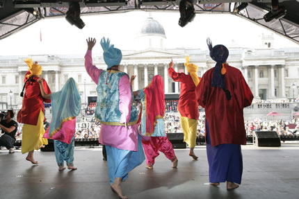 Dancers on stage in Trafalgar Square with the National Portrait Gallery in the background