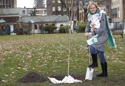 Hermione Norris digging for the Woodland Trust
