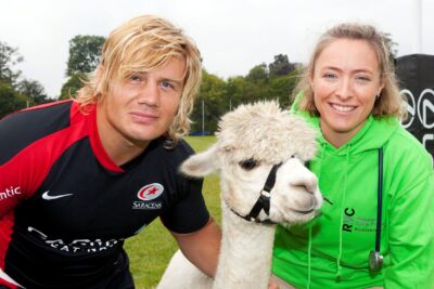Ethienne Reynecke, Quiksilver the alpaca, and the Animal Care Trust's Claire Whitehead