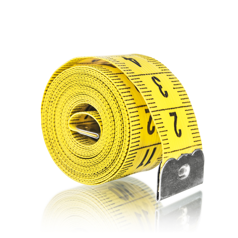 Yellow tape measure wrapped in a tight coil. Photo: Shutterstock.com