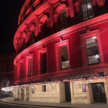 Royal Albert Hall, illuminated with red lighting. December 2022