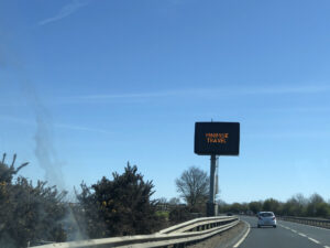 'Minimise travel' road sign. Photo: Howard Lake