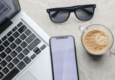 laptop, phone, coffee & sunglasses
