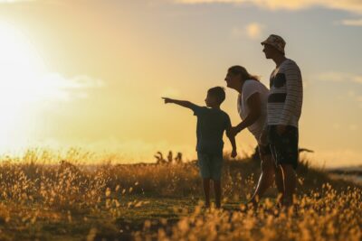 a family walking in the sunset