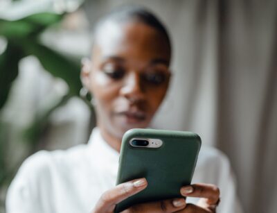 Black woman texting. Photo: Pexels.com