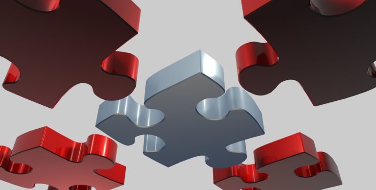 pieces of a puzzle linking together. Photo: Pixabay
