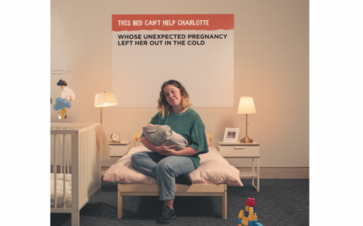 Depaul UK image from a bed is not enough campaign showing a young woman in a room with a baby
