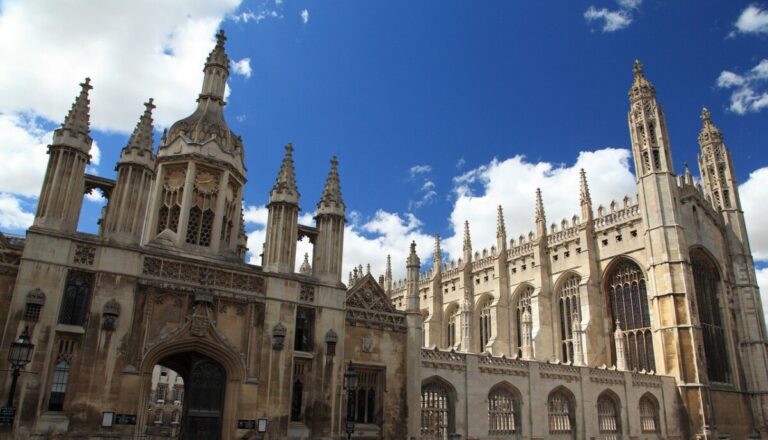 Kings College, Cambridge University under a blue sky with big white clouds